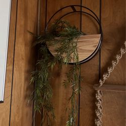 fake plant in cute wood shelf vase