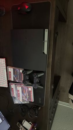 PS3 slim 1tb with games and controllers