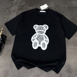 The T-shirt is printed with the classic Dior bear pattern