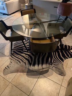 CB2 glass top table and 4 chairs