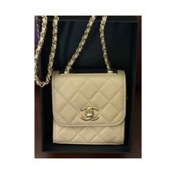 Chanel quilted lambskin mini purse with chain in beige