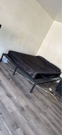 Bed frame with mattress, not right mattress, but still good