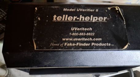 Teller helper fights fraud machine counterfeit money catcher
