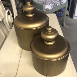2 gold metal canisters