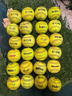 28 assorted 12 inch softballs