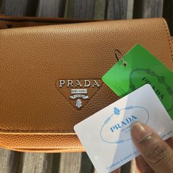 Prada logo-plaque leather shoulder bag
