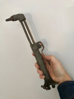 Small acetylene cutting torch.