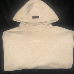 Fear of God Essentials cream hoodie 