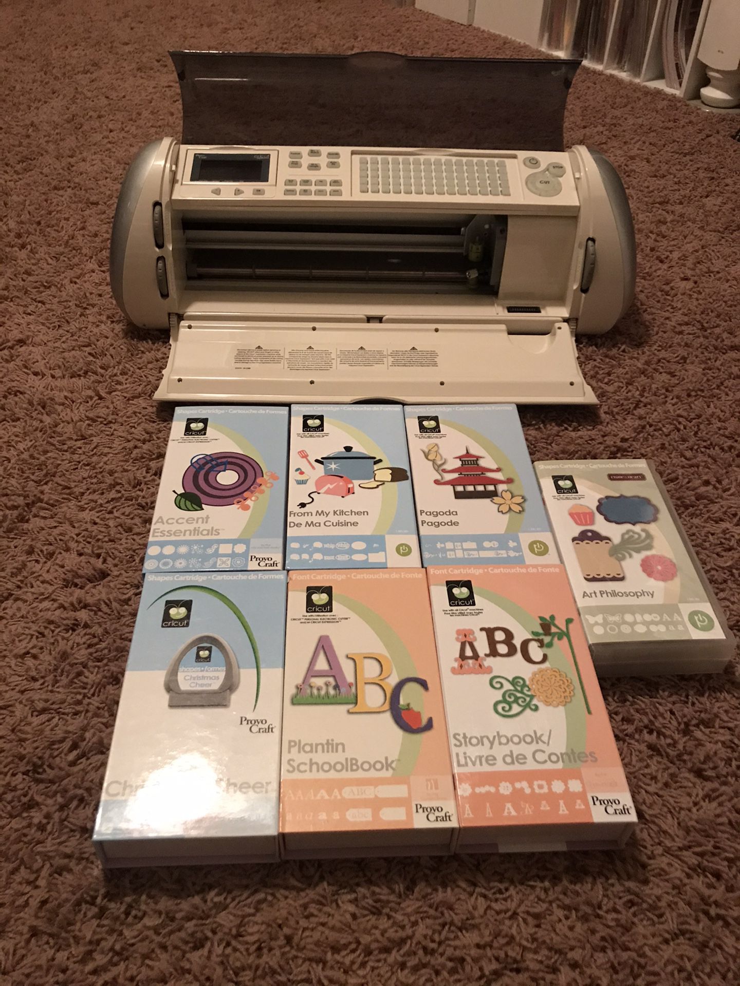Cricut Expression with cartridges and tools