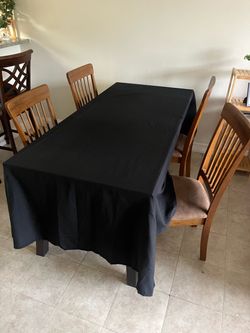 wooden dining table with chairs