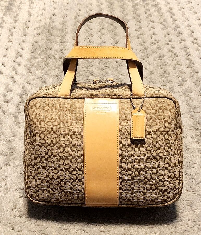Coach Travel Train Cosmetic case/bag paid $145 Like New! No signs of wear. Signature Jacquard Toiletry bag. Color Brown & Tan Measurements 11"L x 4"W