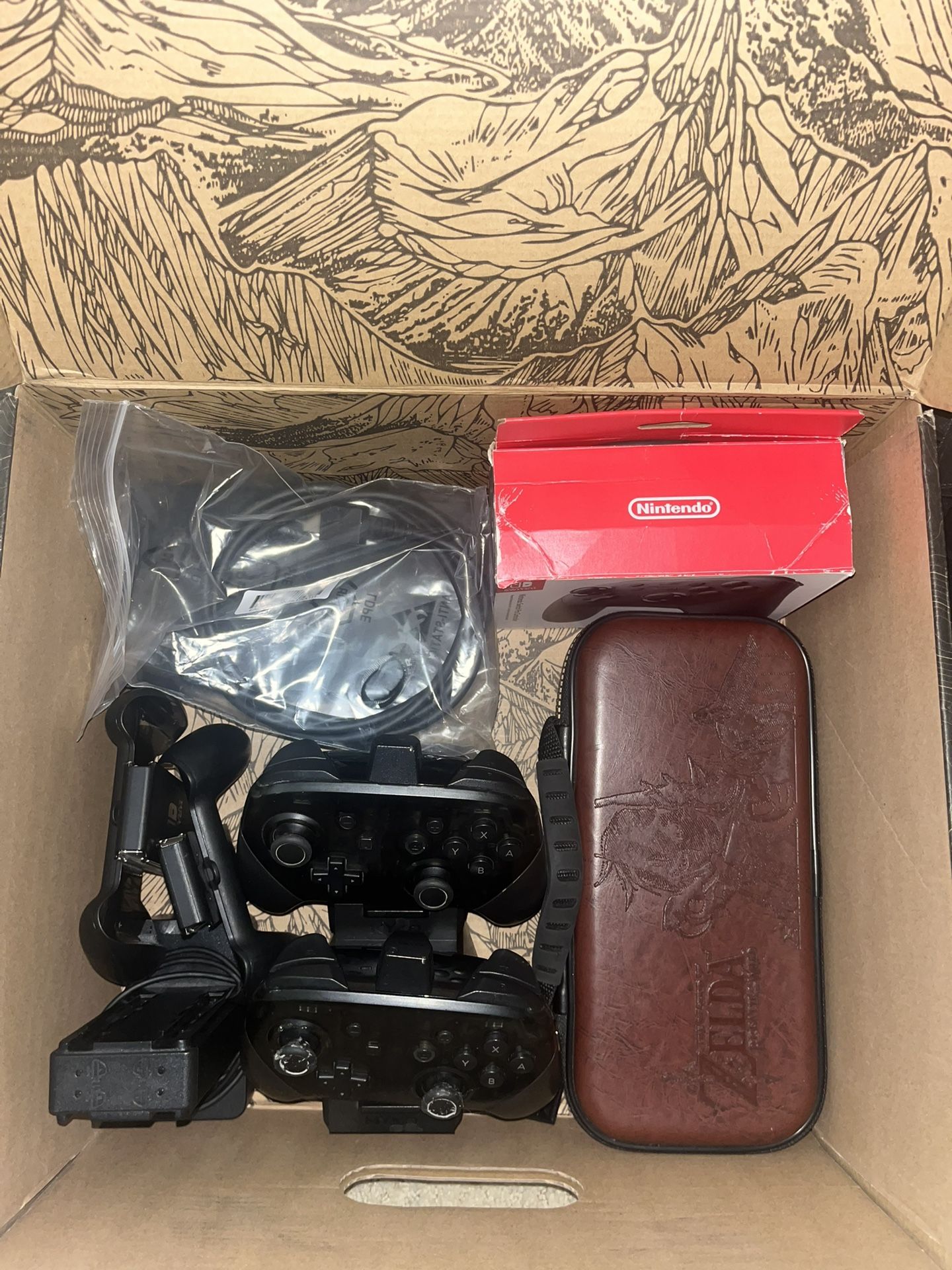 Used Nintendo Switch With 2 Pro Controllers, 2 Joy Con Controllers, Case, Dock, Charging Station, And Power Supplies.