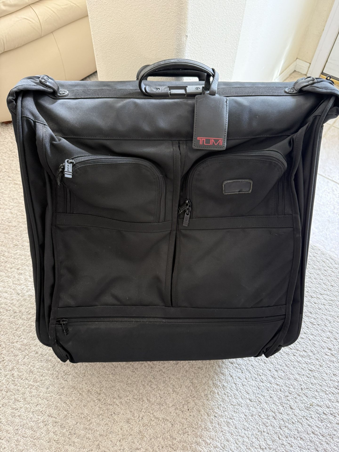 Suitcase Tumi Rolling Garment Bag.