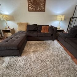 Dark brown sectional couch with Ottoman and throw pillows