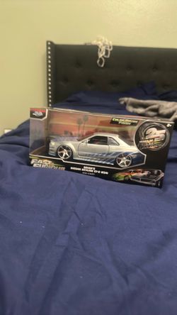 A die cast fast and furious series Paul walker sky line Gtr r34 a model car