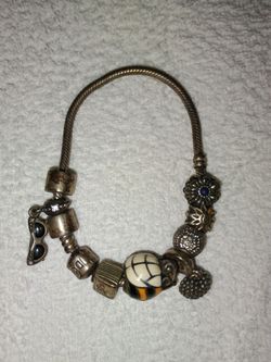 Womens Pandora  Bracelet with retired pieces