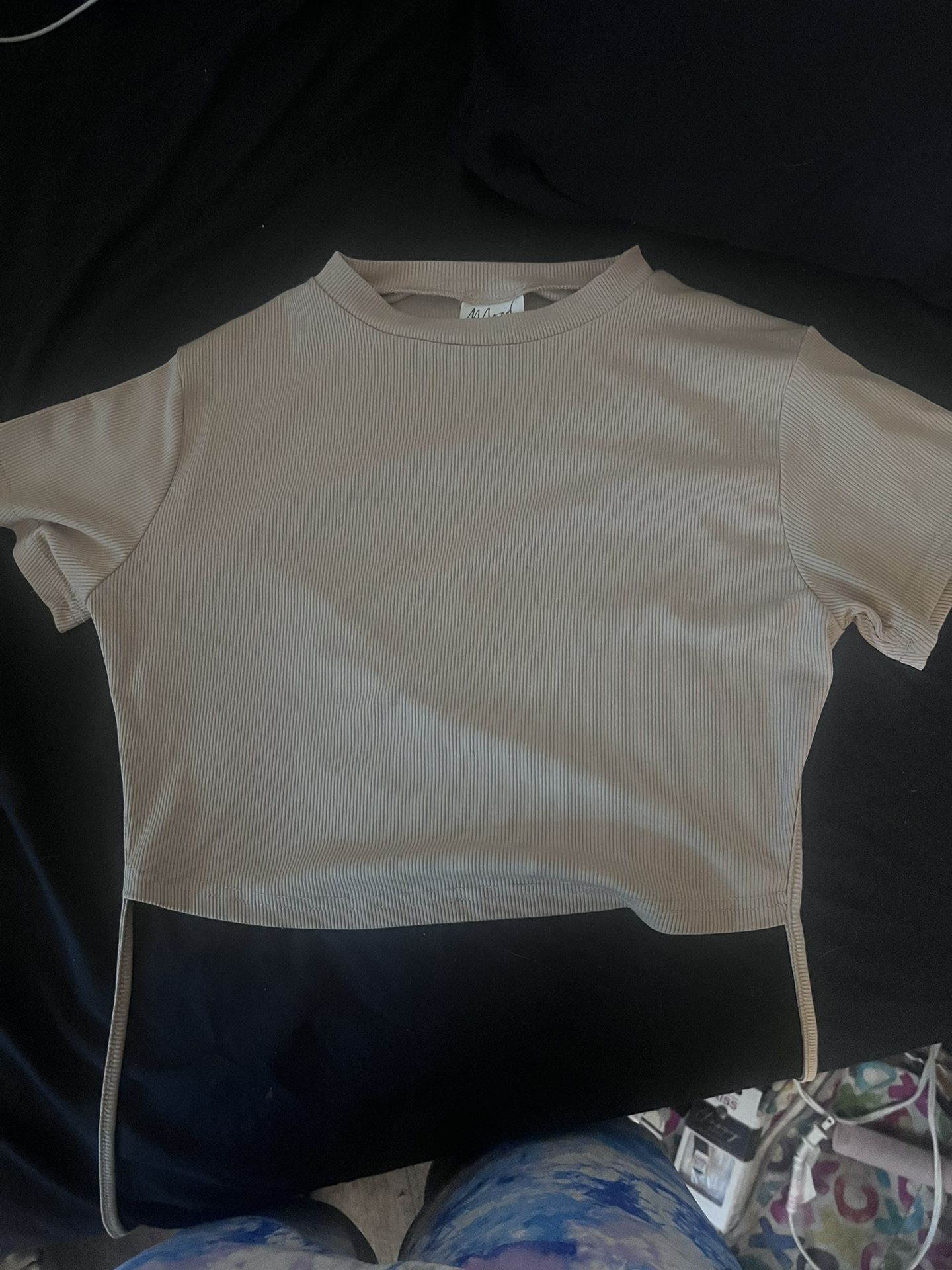 white too off the shoulder and a tan shirt with open back