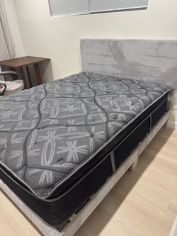 Queen size mattress + Brand New queen size frame assembled!