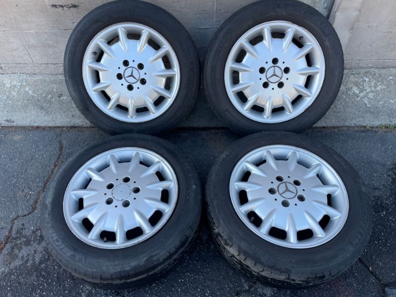 Four Mercedes E320 16 inch Aluminum wheels with old tires 5 on 112mm -T04790