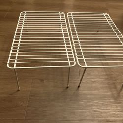 2 white wire racks