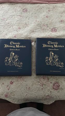 Two Disney stamp collectors books from 1990s