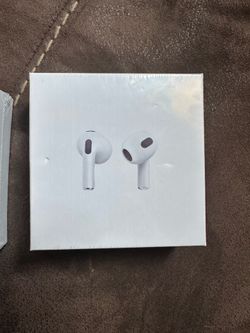 white wireless earbuds in a charging case
