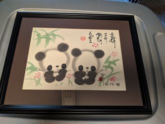 Framed panda painting with matte