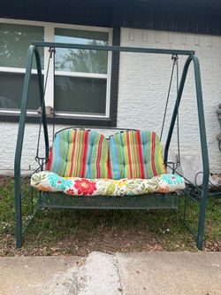 Iron outdoor patio swing with cushions
