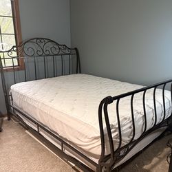 Wrought iron queen sleigh bed