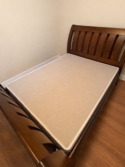 Queen size wood sleigh bed with boxspring and nightstand