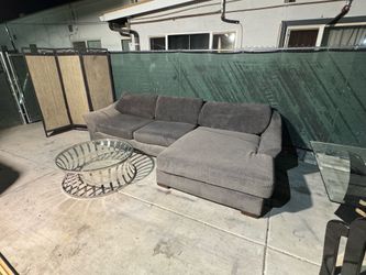 Gray sectional couch .. free delivery available