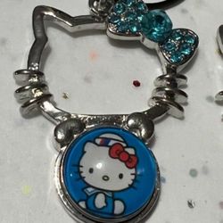 Hello Kitty snap pendant w/ ONE snap pictured in the main photo. 