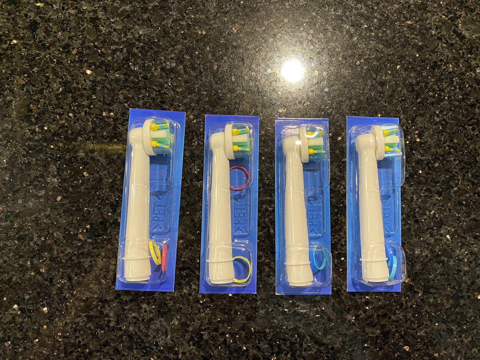 Four Genuine Oral B Electric Replacement Toothbrush Heads White 4 704 132-00