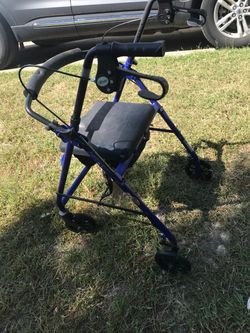 Nice four wheel fold up seat walker with hand brakes only $50 firm