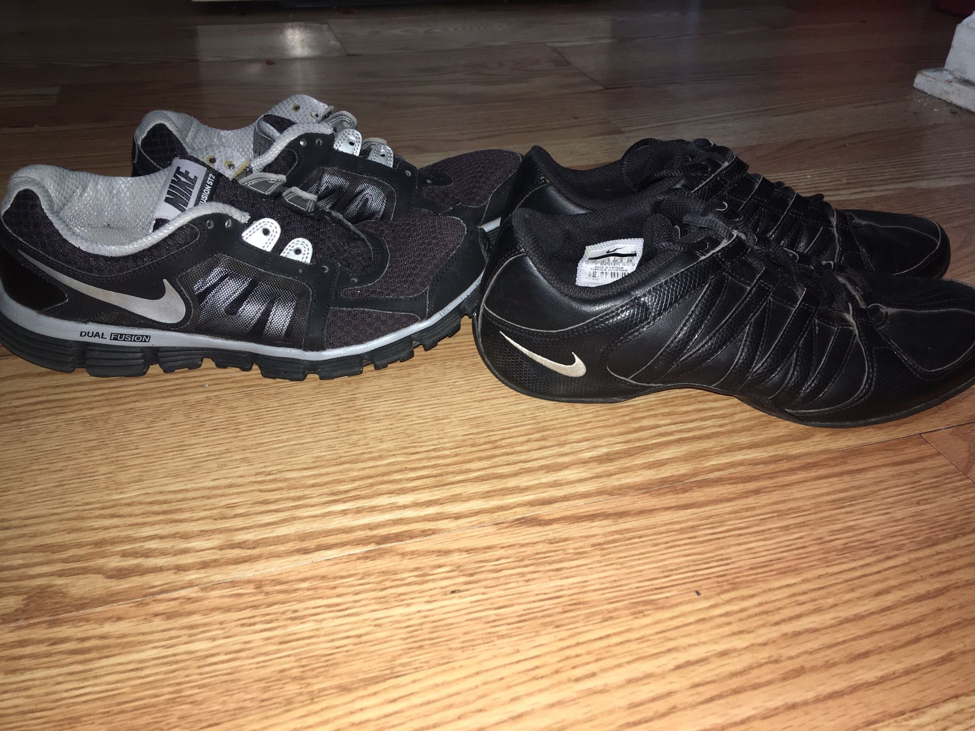 2 pairs women’s size 9 black Nike shoes