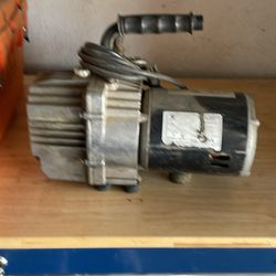 Air conditioner, evacuation pump