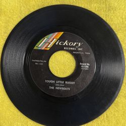 This is a vintage 1964 7-inch vinyl record of "Bread and Butter" by The Newbeats. 