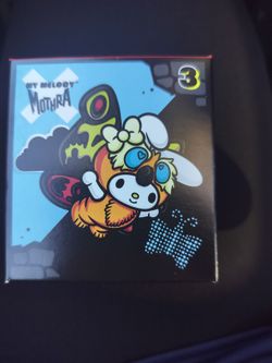 Hello kitty godzilla toy