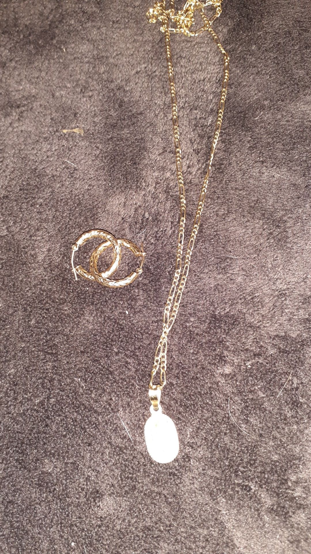 22 inch gold figaro chain with 10 k virgin mary charm and 14 kt hoop earrings real not plated