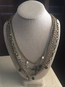 Multiple chain necklace with locket and cross
