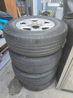 Toyota 18" Rims and all 4 matching covers, — NOT being sold as usable tires. Buyer must take all