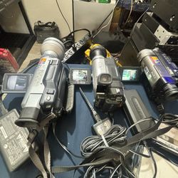 Three Handy Cams And Sony Printer With Sony Lenses And Batteries And Cords/Chargers In Super Great Condition For Vhs Tapes