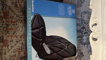Massaging seat topper with heat