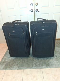 Two Large America airline canvas suitc( $25.00 each )