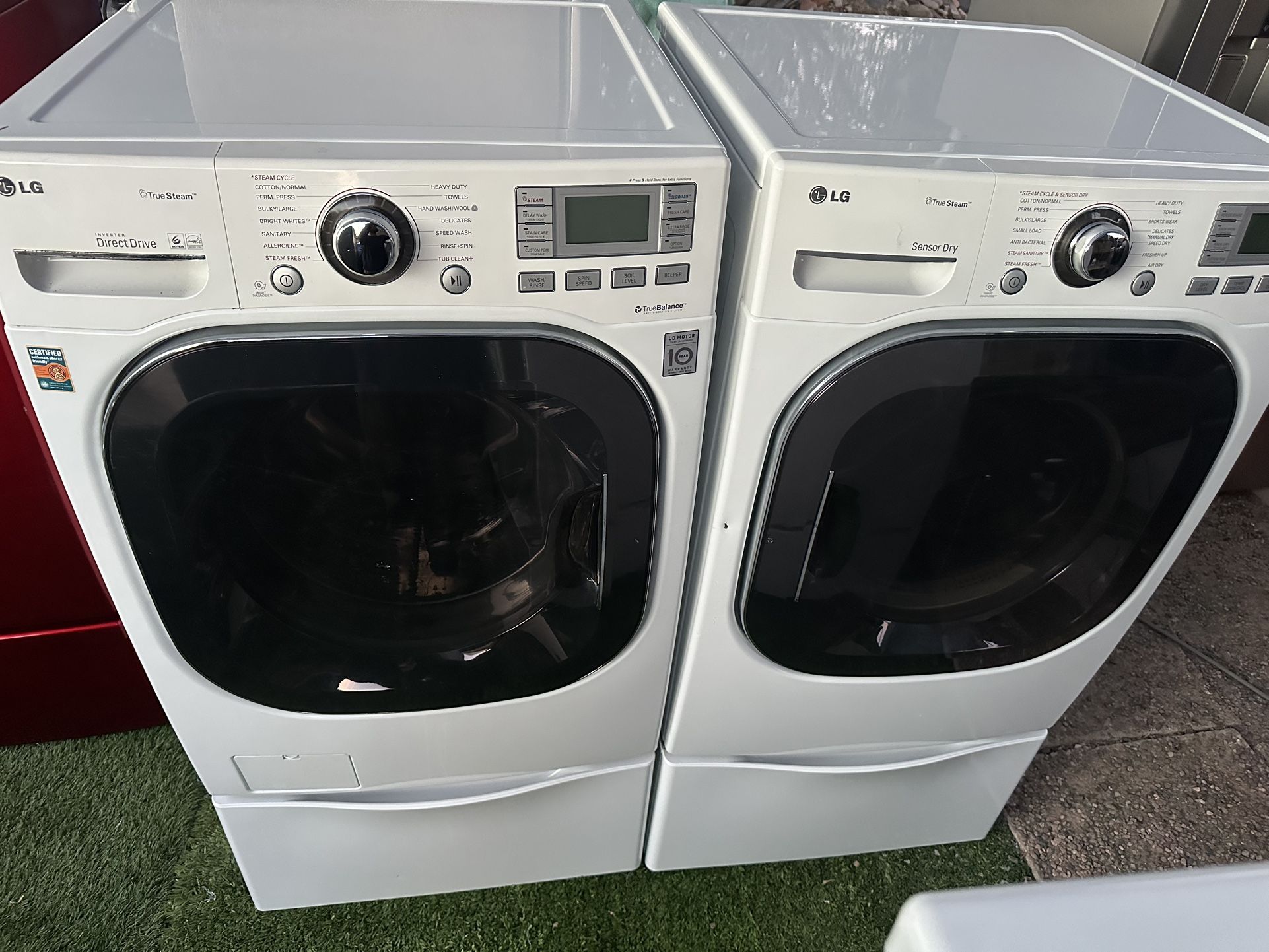 LG front load washer and electric dryer on pedestals!
