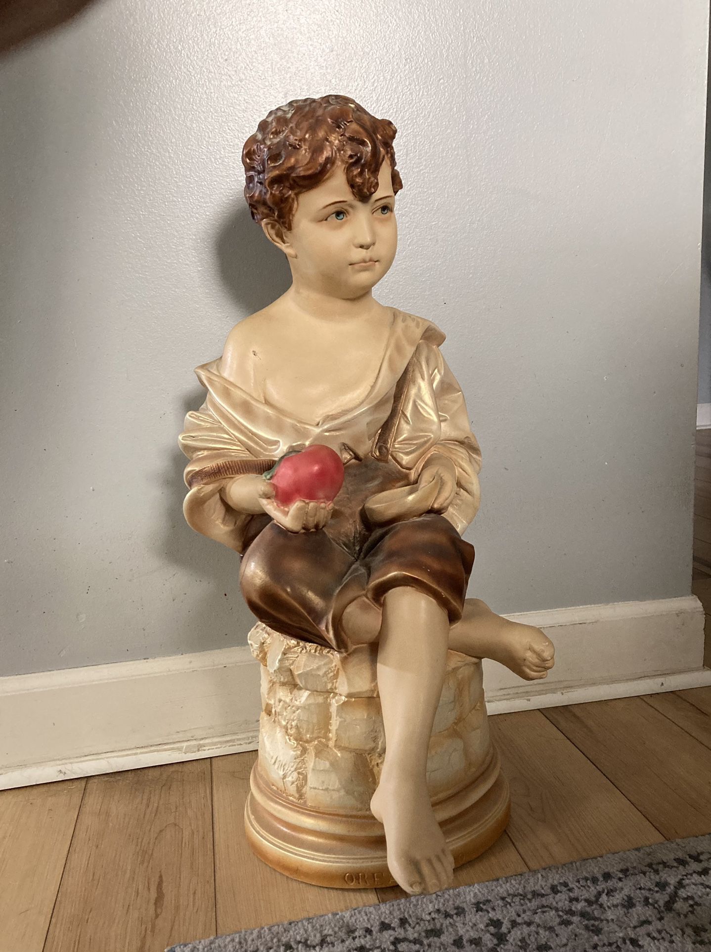 Large Plaster Statue.  Boy with Apple. Approximately 25” tall