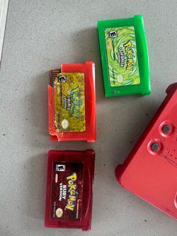 GBA SP with charger and authentic pokemon games