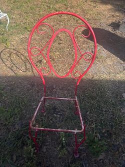 Two Red Metal Chairs