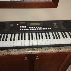 Roland E-X10 Arranger Keyboard with Music rest stand and Power Adapter