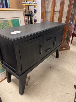Black Sideboard featuring a textured black finish with modern rectangular hardware